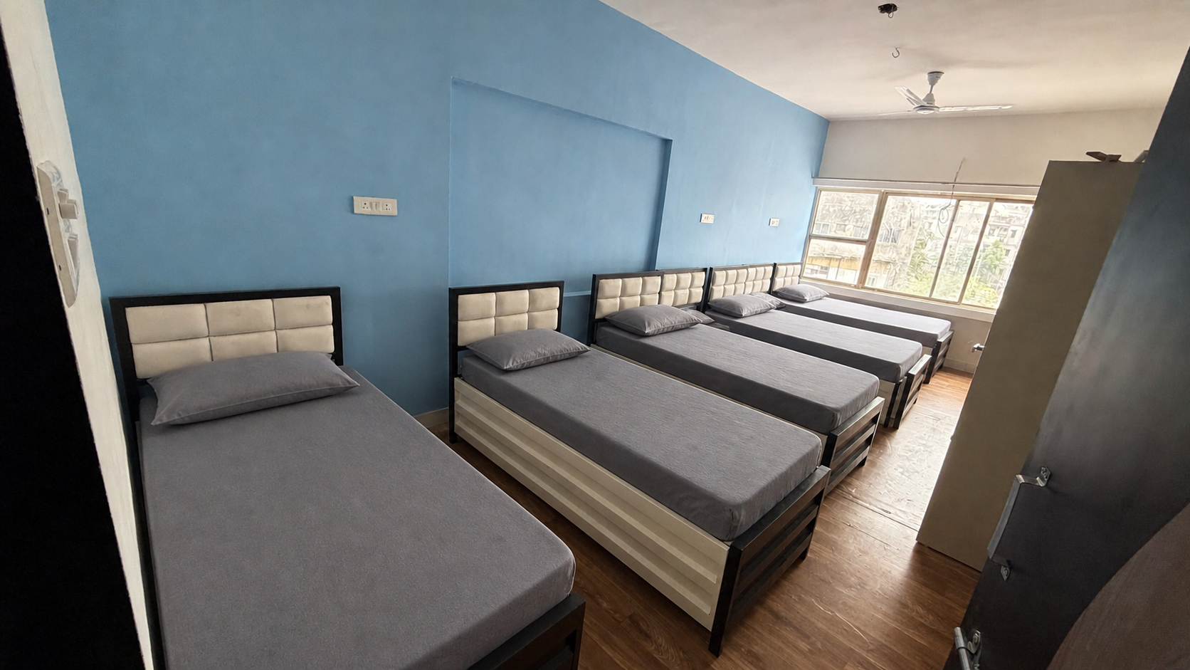 Affordable 5+ Sharing PG Room near NID and GLS